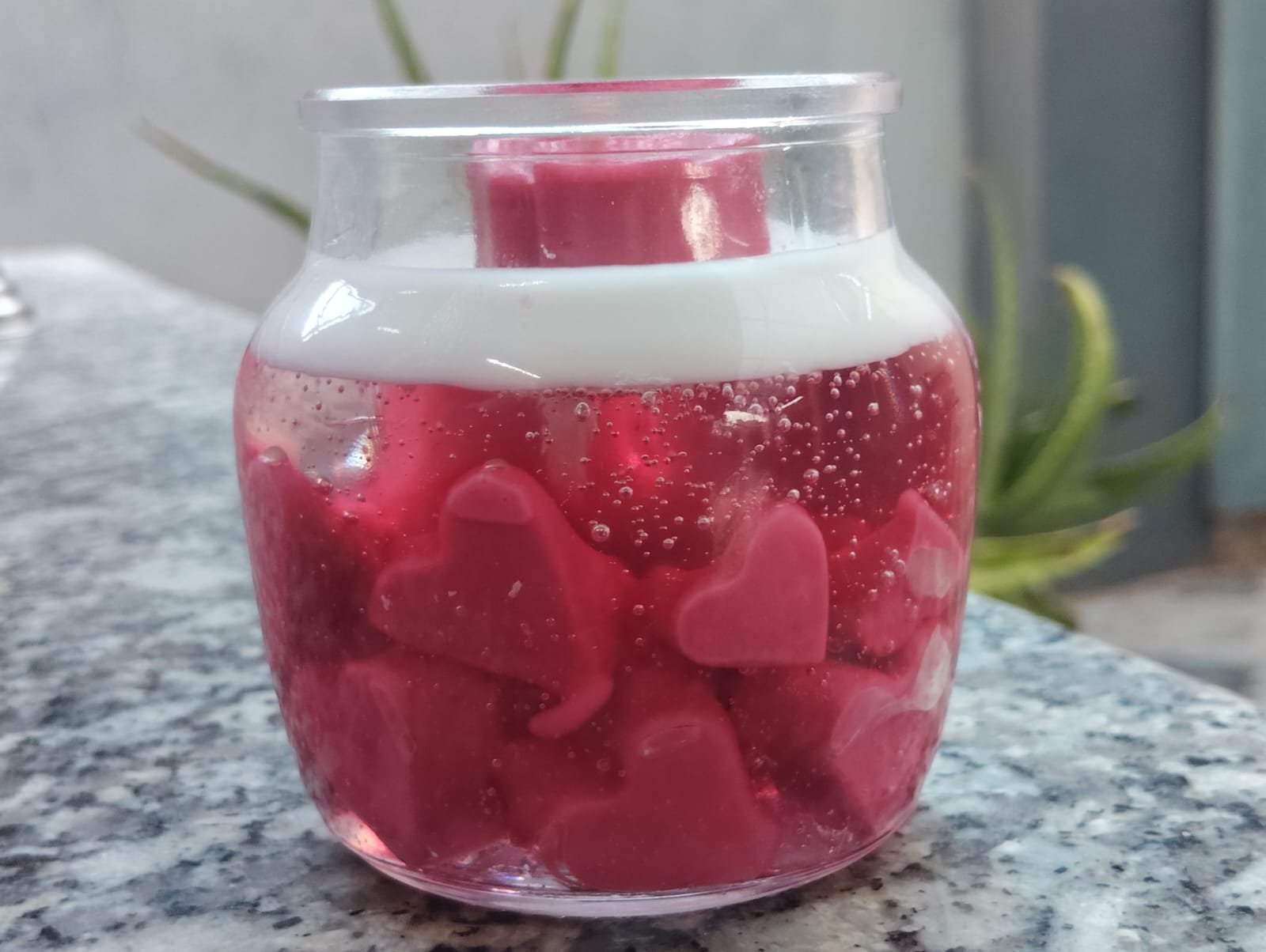 Hand-poured candle with wax hearts